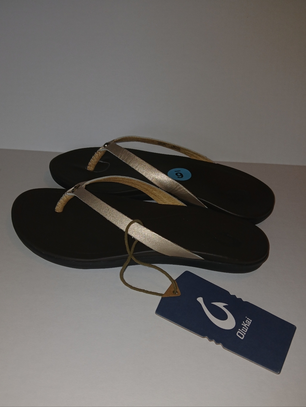 OluKai Ho'Opio Leather Thong Flip Flops, Metallic Gold, Rubber Cushion
